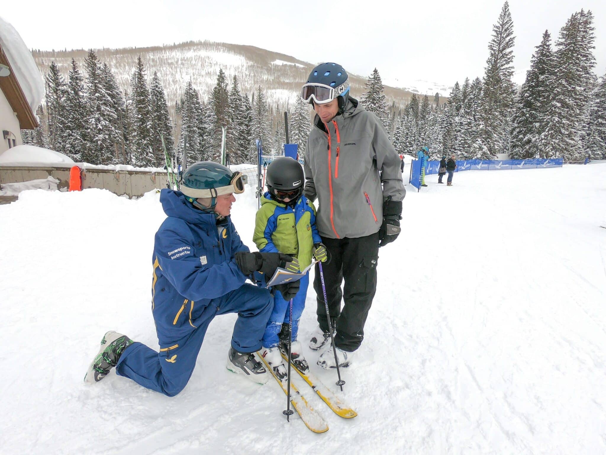 kid at ski school with instructor