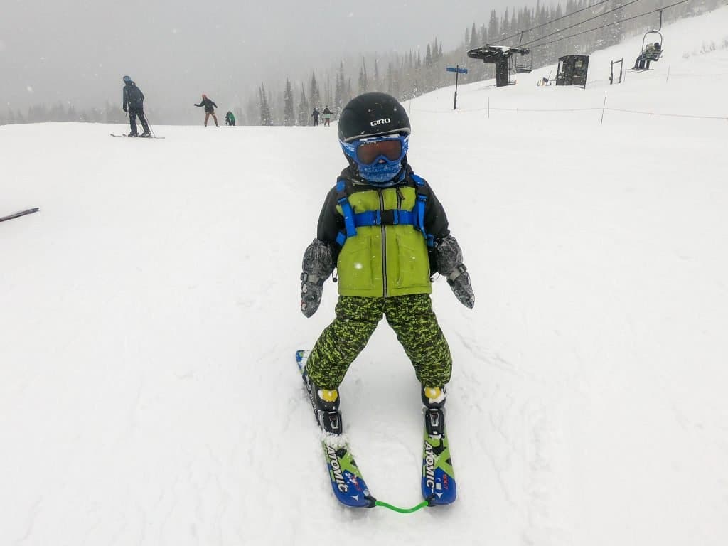 toddler skiing with face mask