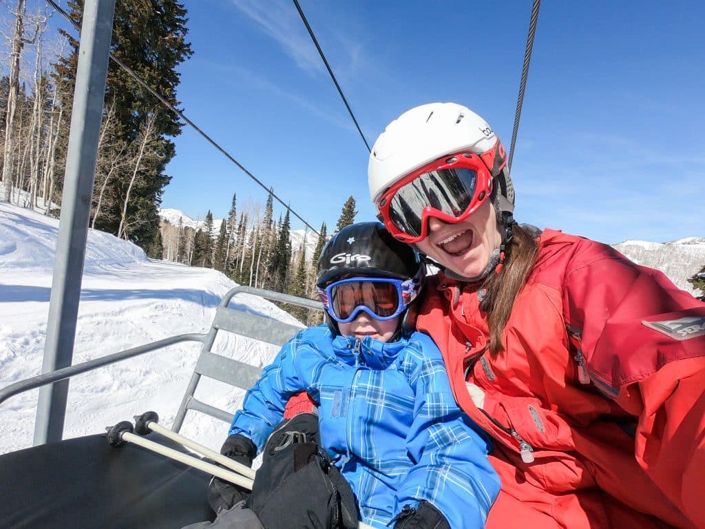 On a ski lift with toddler