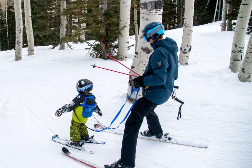 little boy using a ski harness