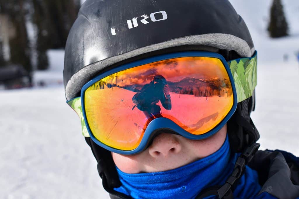 Boy wearing Giro helmet and goggles