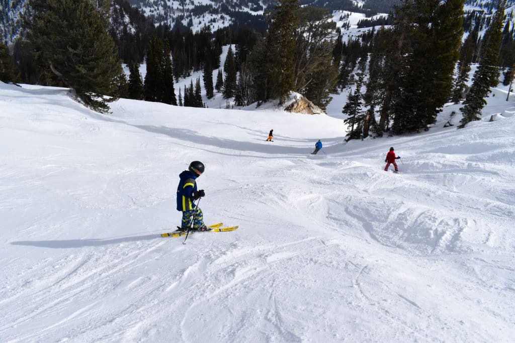 family skiing together