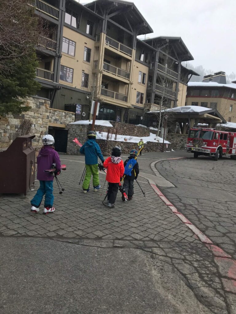 kids walking with skiis