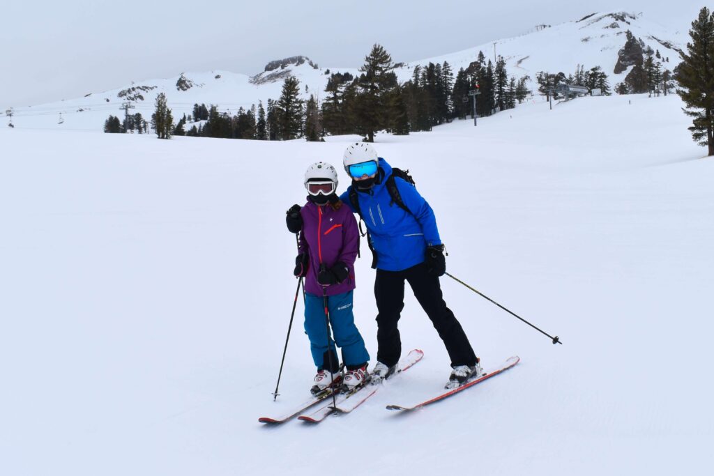 mom and daughter skiing