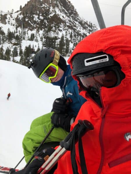 kids skiing on a stormy day