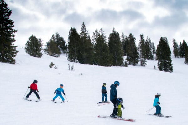 family skiing together at solitude