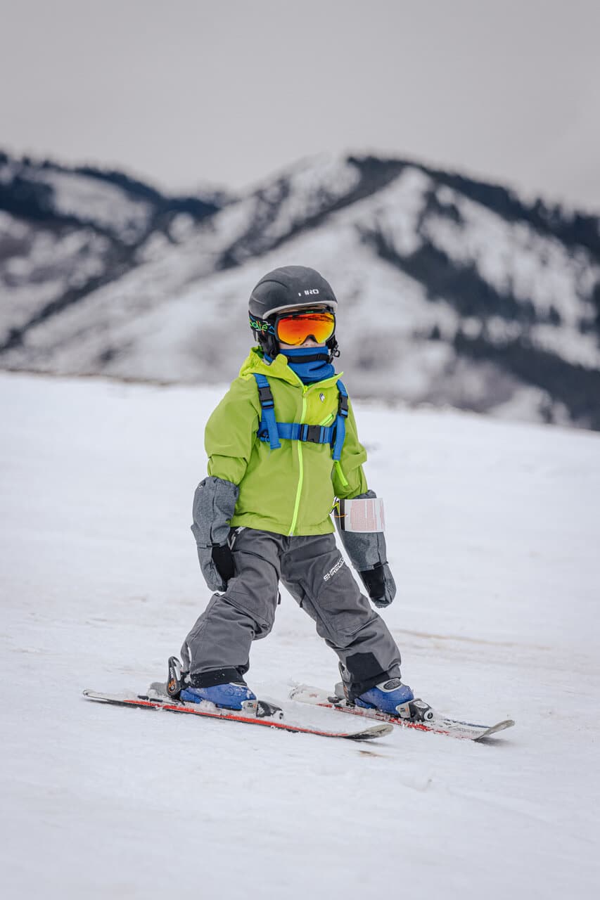 Little boy skiing in the mountains