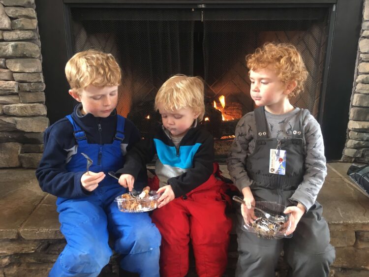 Family eating lunch in the lodge