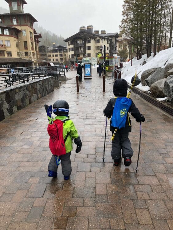 kids wearing a ski backpacks