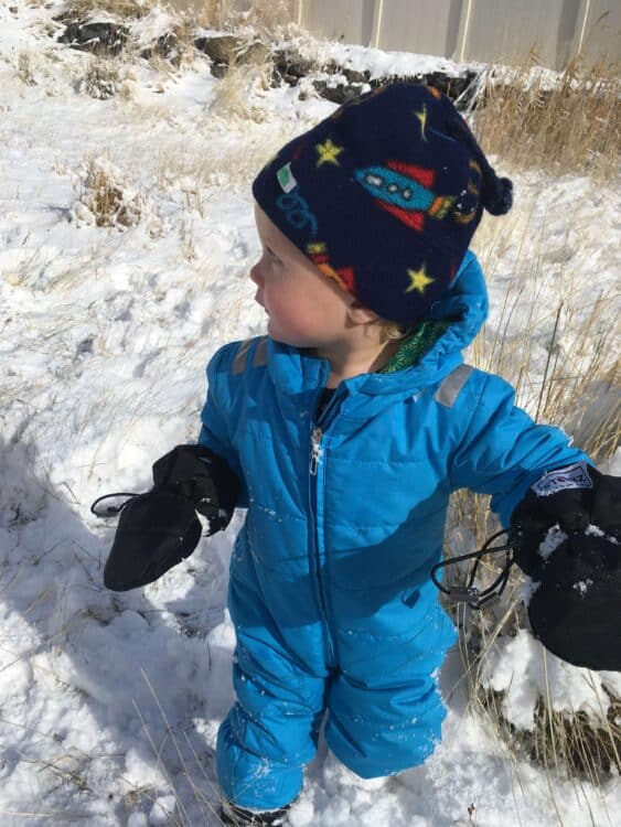 Toddler playing in snow