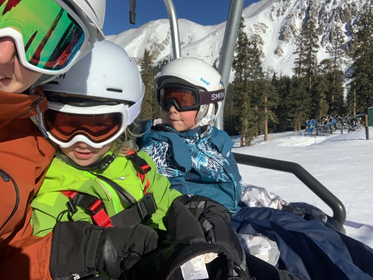 Family riding up ski lift