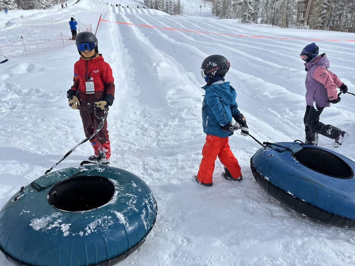 family skiing at brianhead utah powder day