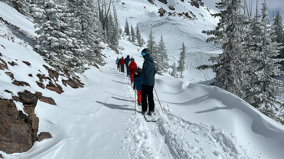 family skiing at brianhead utah powder day