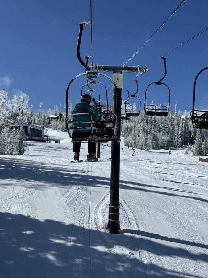 family skiing at brianhead utah powder day