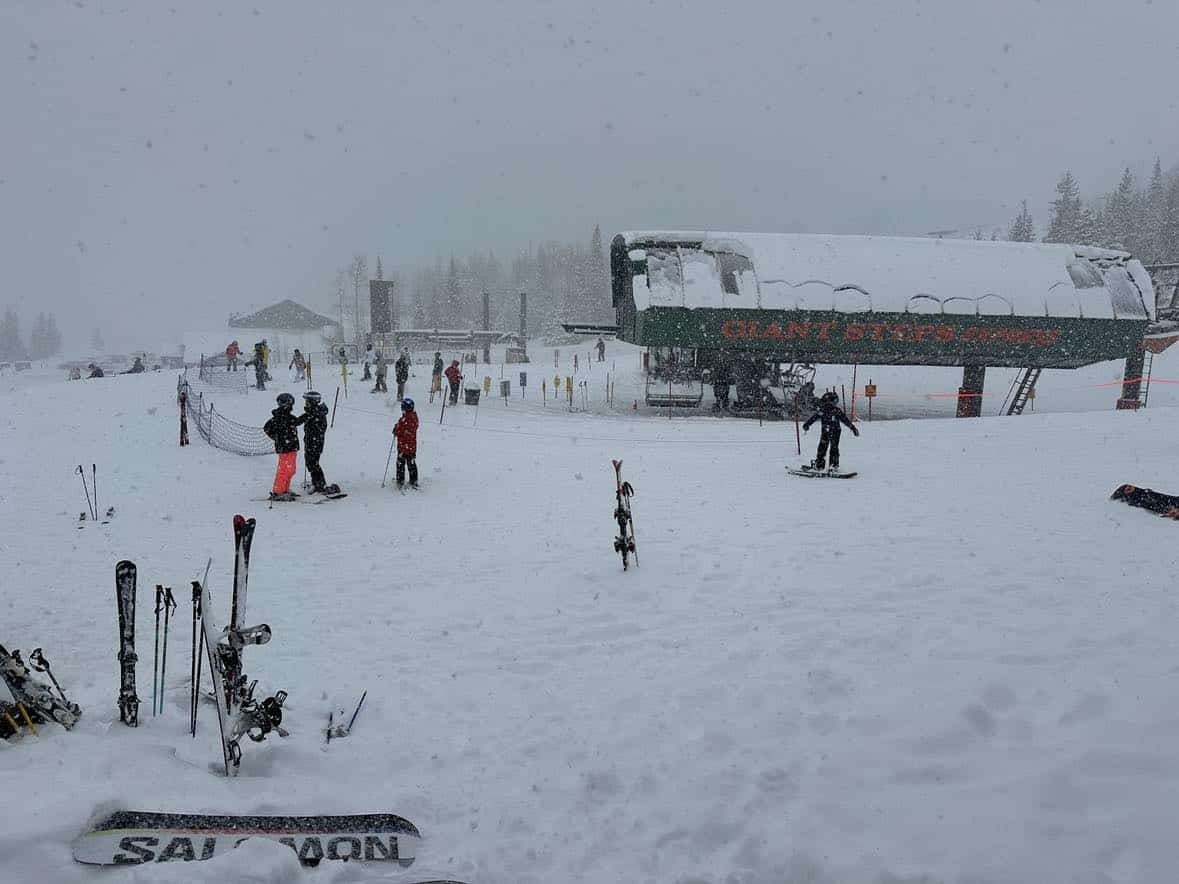 family skiing at brianhead utah powder day