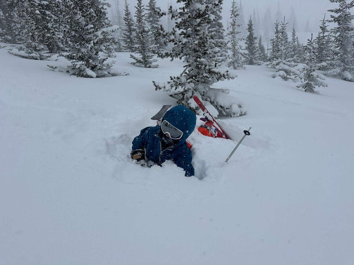 family skiing at brianhead utah powder day