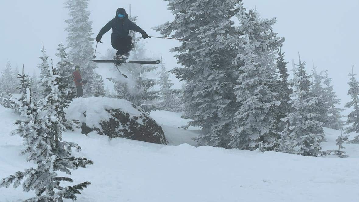 family skiing at brianhead utah powder day