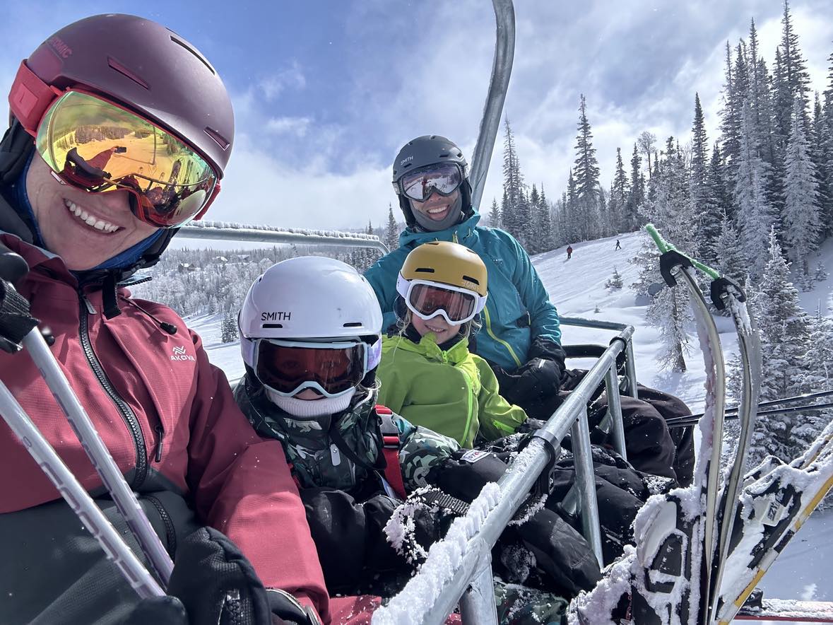 family skiing at brianhead utah powder day