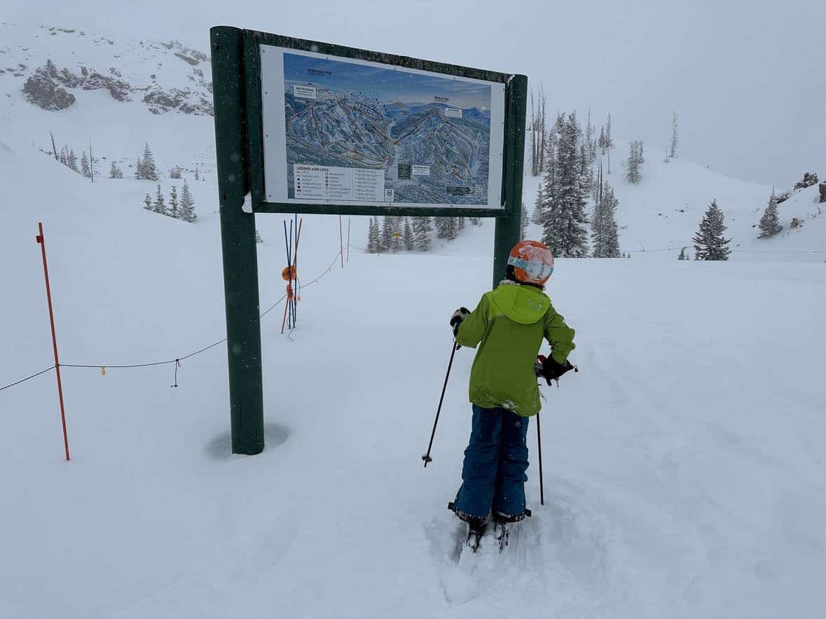 family skiing at brianhead utah powder day